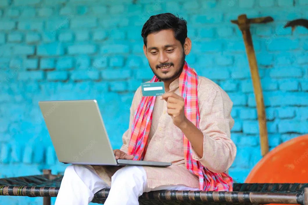 /kvplus/articles/digital-payment-concept-indian-farmer-using-laptop-card-home_75648-7388.webp
